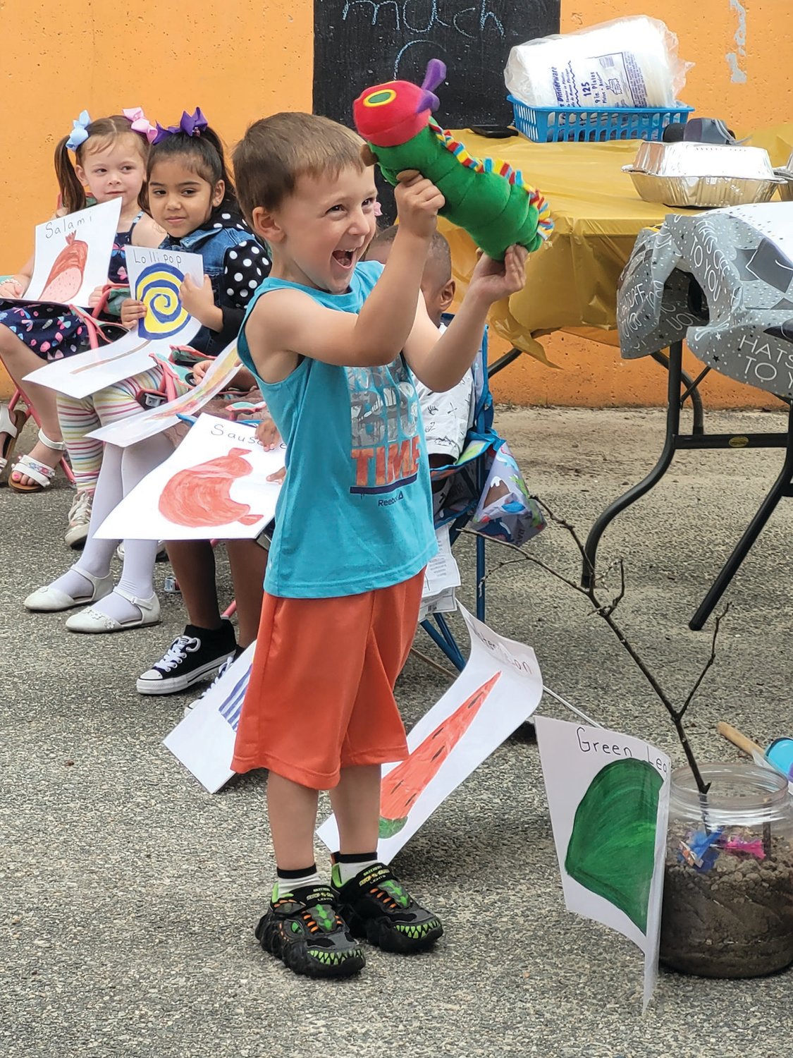 CERTIFIED PRE-K: Ms. Robin and Ms. Michaela’s RI State Pre-K Class celebrated their graduation to Kindergarten during a ceremony and show last week. They read and acted out “The Very Hungry Caterpillar” by Eric Carle.